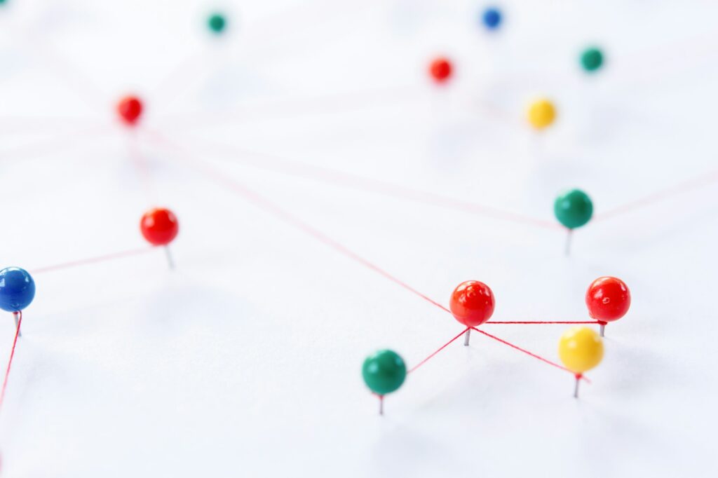 connection between the two networks. Network simulation on paper linked together by yarn